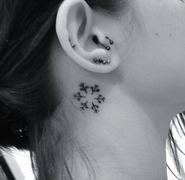 Behind-the-ear snowflake tattoo by Resul Odabas