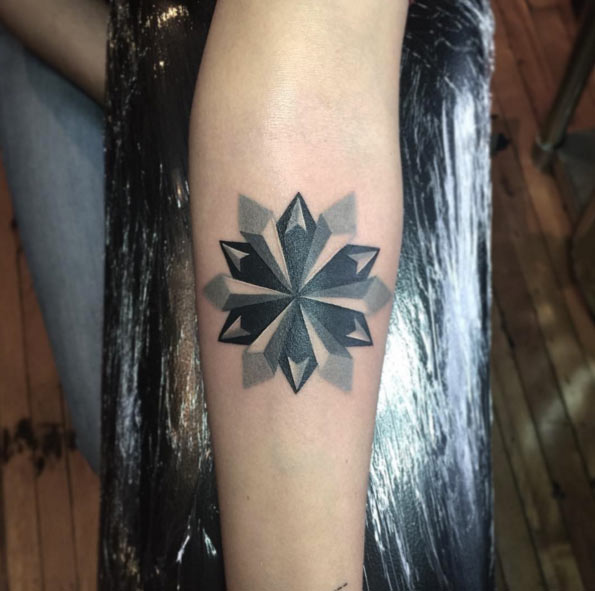 Black and grey ink snowflake tattoo by Karl Marks