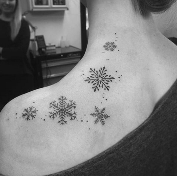 Black ink snowflake tattoos by The Old Barber Shop
