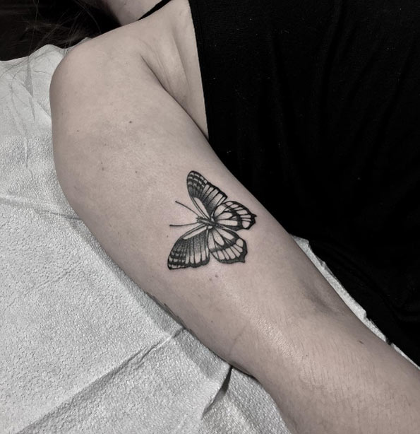 Blackwork butterfly tattoo by Justin Olivier