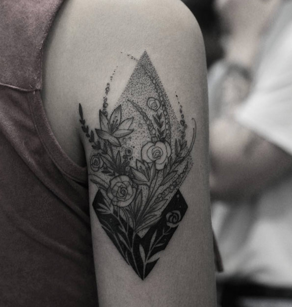 Botanical back arm tattoo by Ricardo Da Maia