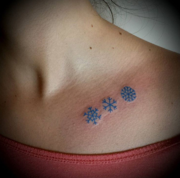 Collarbone snowflake tattoos by Orlandi Francesco