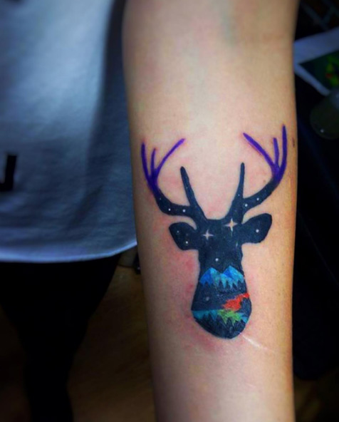 Colorful stag landscape tattoo by Miguel Medina
