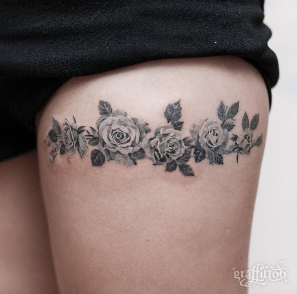 Blackwork floral band on thigh by Tattooist River