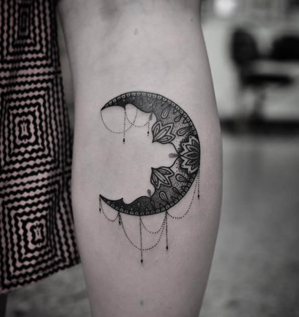 Blackwork crescent moon tattoo by Chris Jones