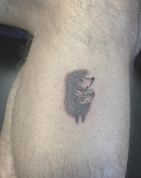 Single needle hedgehog tattoo by East Iz