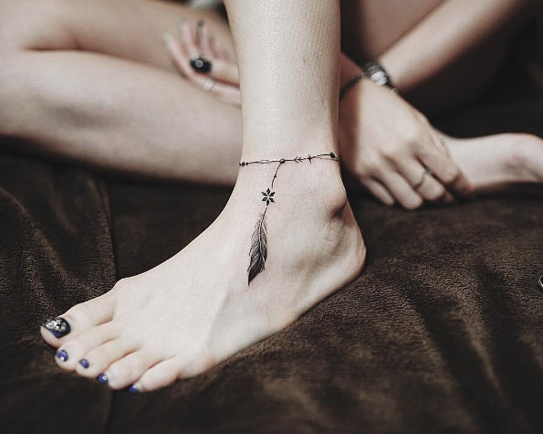 Feather anklet tattoo by Nando Tattooer