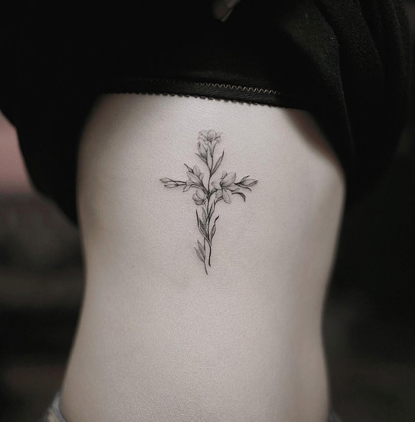 Floral cross tattoo by Nando