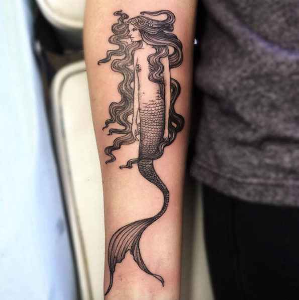 Mermaid tattoo on forearm by June Jung