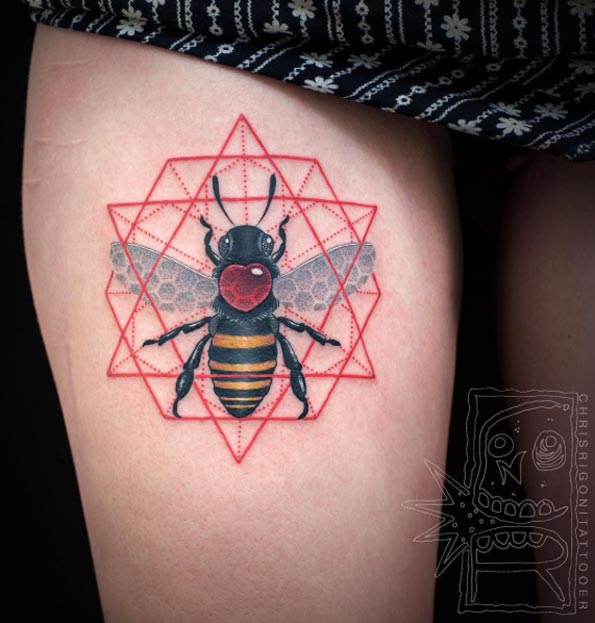 Geometric bee tattoo on thigh by Chris Rigoni