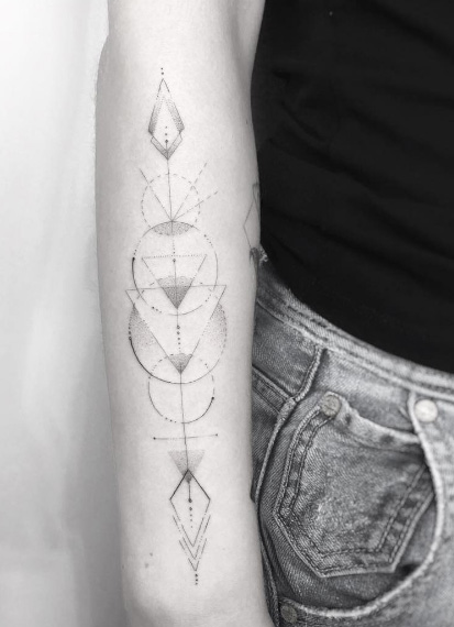 Geometric forearm tattoo by Jakub Nowicz