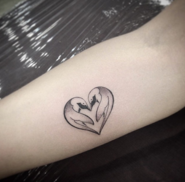 Heart-shaped penguin tattoo by Ivy Saruzi