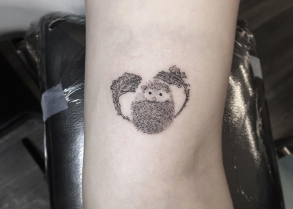 Heart-shaped hedgehog tattoo by Zeke