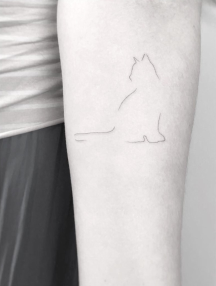 Barely-there cat tattoo by Jakub Nowicz