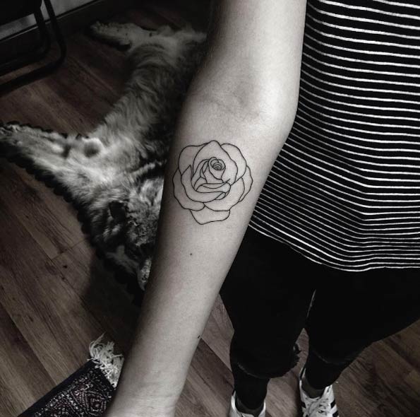 Minimalistic rose tattoo by Mateo Gonzalez