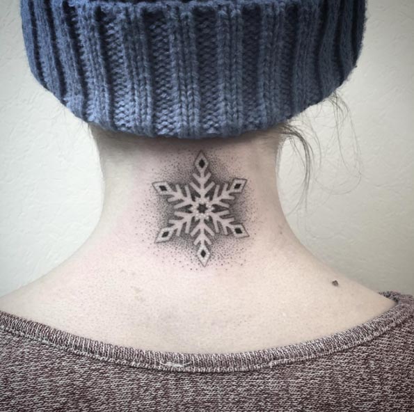 Negative space dotwork snowflake tattoo by Fanny