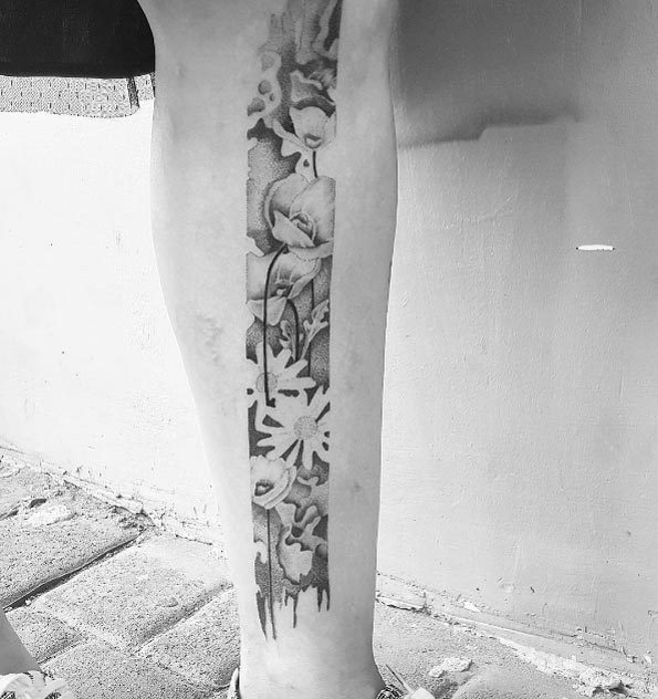 Poppy strip tattoo by Noam Yona