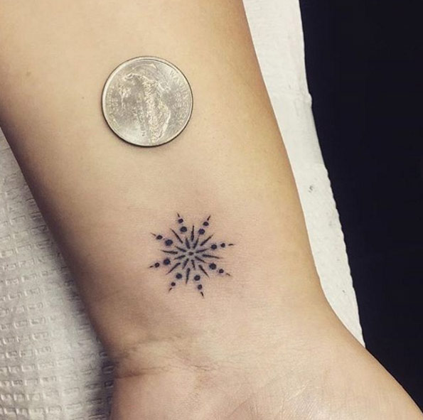Super small snowflake tattoo by Black Rose