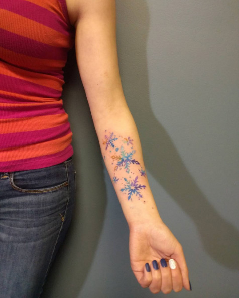 Colorful snowflakes on forearm by Anthony Robicheau