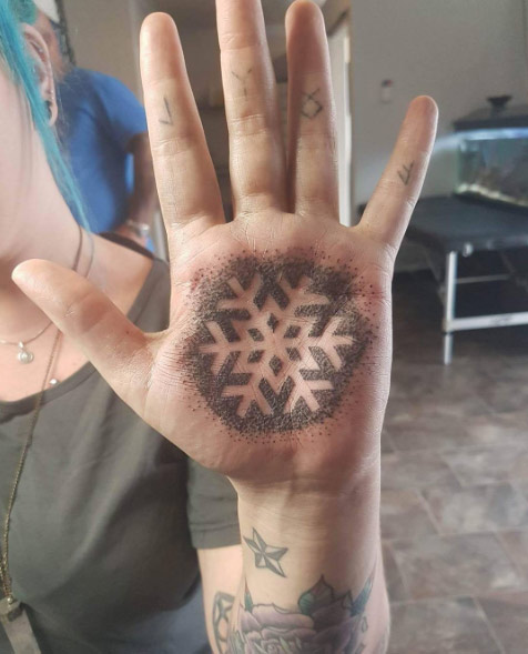 Negative space snowflake on hand by Katt