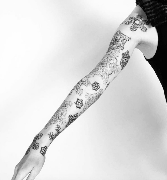 Snowflake sleeve tattoo by Inga Hannarr