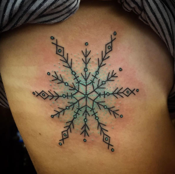 Turquoise snowflake tattoo by Sara Antoinette