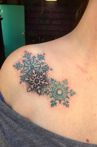 Blue, black, and green snowflakes by Alex Ortagus