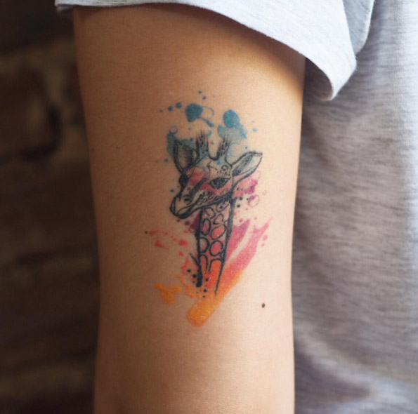 Watercolor giraffe tattoo by Baris Yesilbas