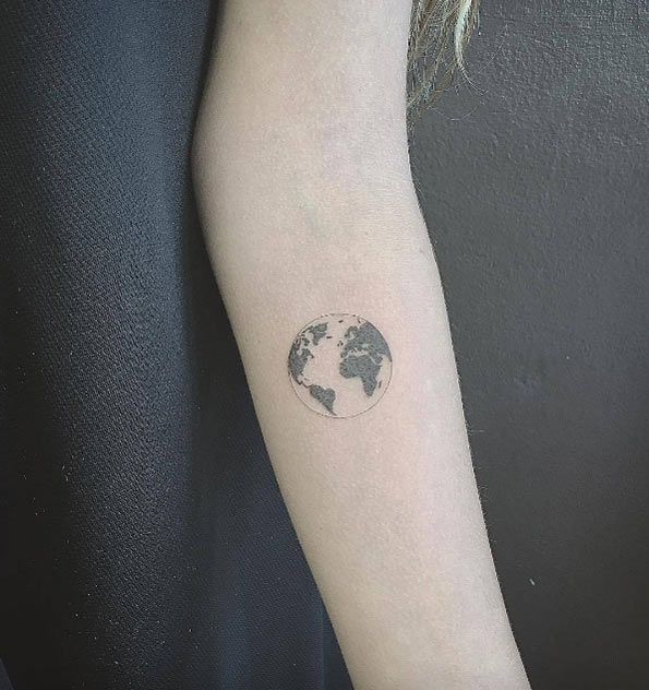 Tiny globe tattoo by East Iz