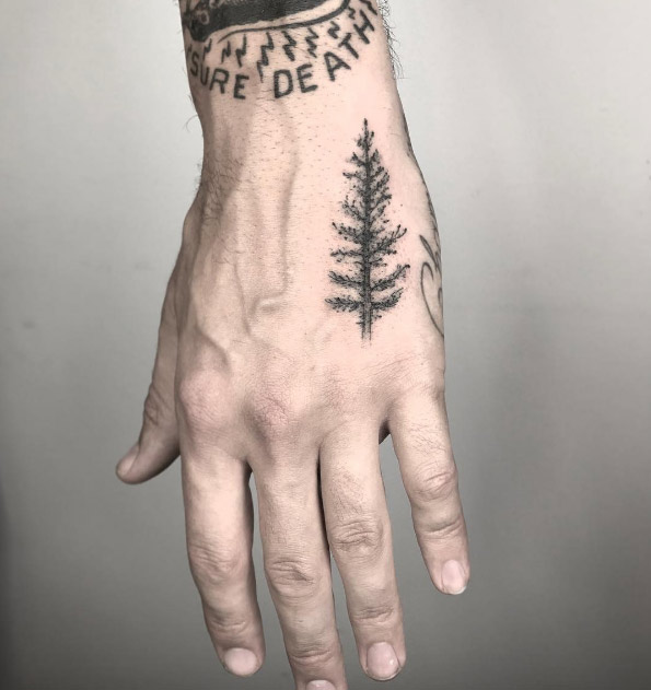 Tree tattoo on hand by Nathan Kostechko
