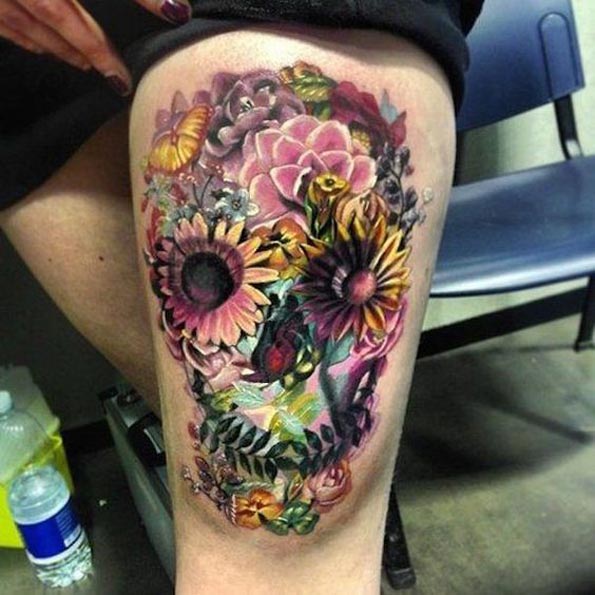 Large floral skull on thigh by Antonio Proietti
