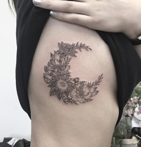 Floral crescent moon on rib cage by Bonnie