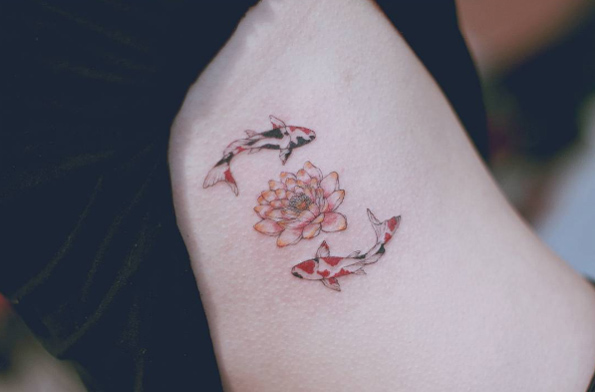 Lotus flower with koi fish tattoo by Seoeon