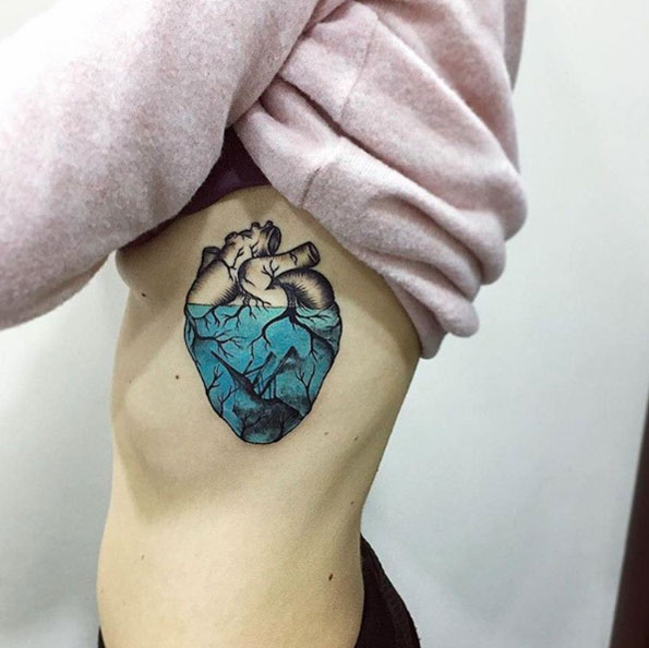 Half-blue heart tattoo by Vika Naumova
