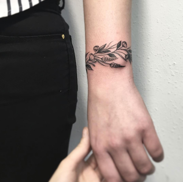 Botanical bracelet tattoo by Vlada Shevchenko