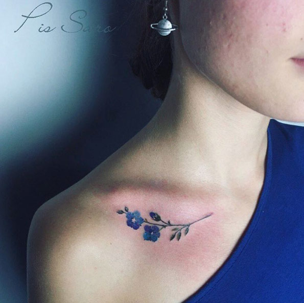 Collarbone flower tattoo by Pis Saro