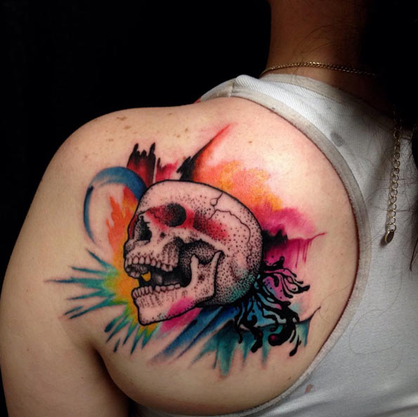 Colorful skull tattoo on back shoulder by Nathan Fisher