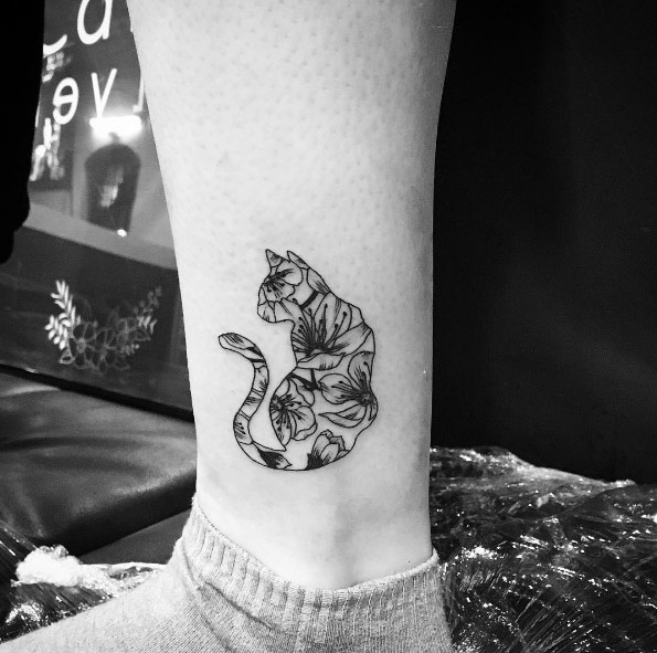 Floral cat tattoo by Carin Silver