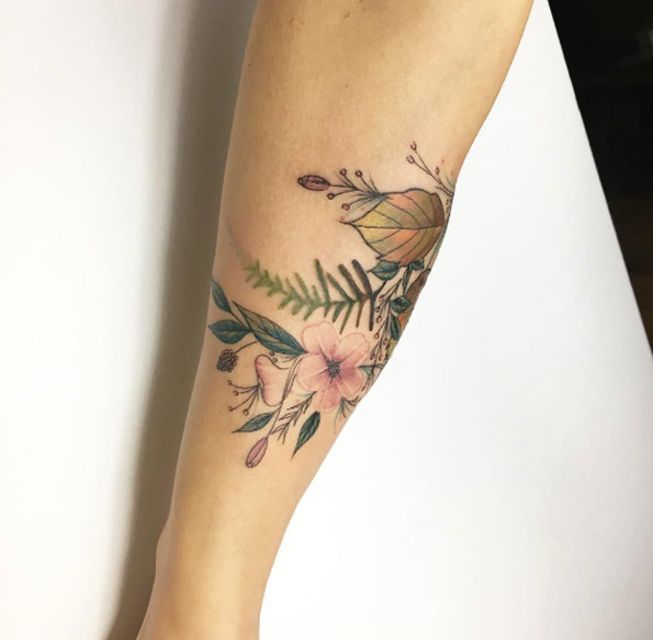 Floral forearm tattoo by Fatih Odabas
