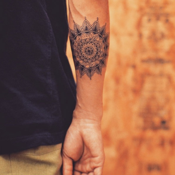 Mandala flower on forearm by Tattooist Grain