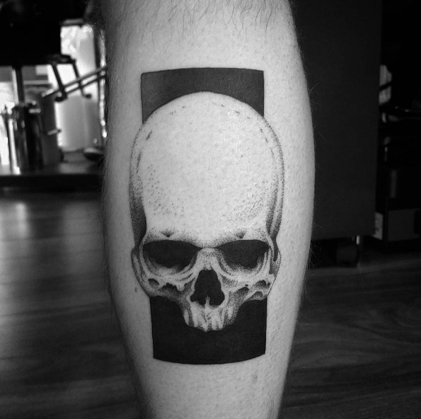 Negative space skull tattoo by Matt Pettis