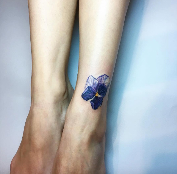 Stunning pansy tattoo by Rita