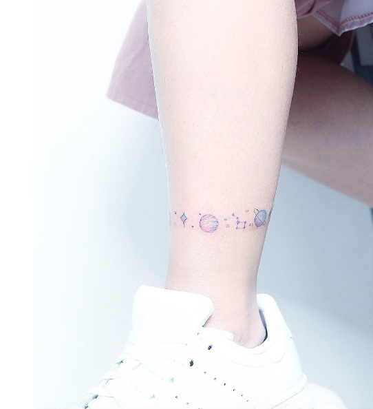 Cute cosmic anklet tattoo by Mini Lau