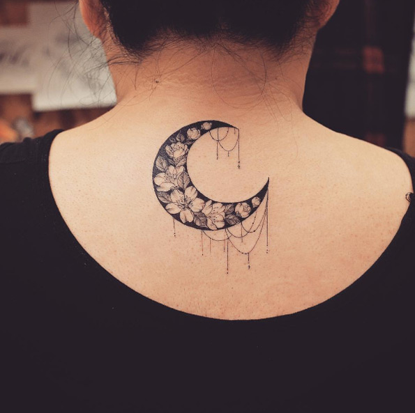 Flower-filled crescent moon by Tattooist Grain