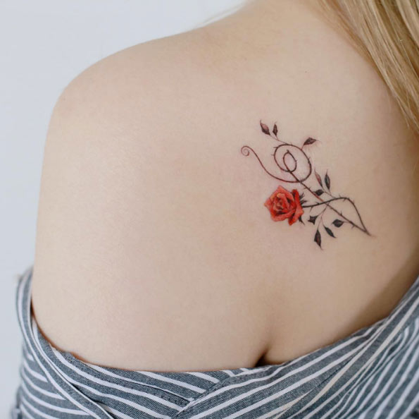 Thorny rose tattoo on back shoulder by Tattooist Doy