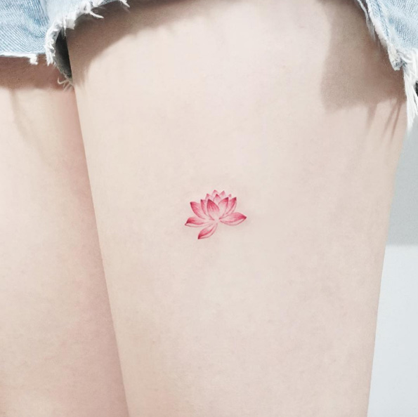 Tiny lotus flower tattoo by IDA