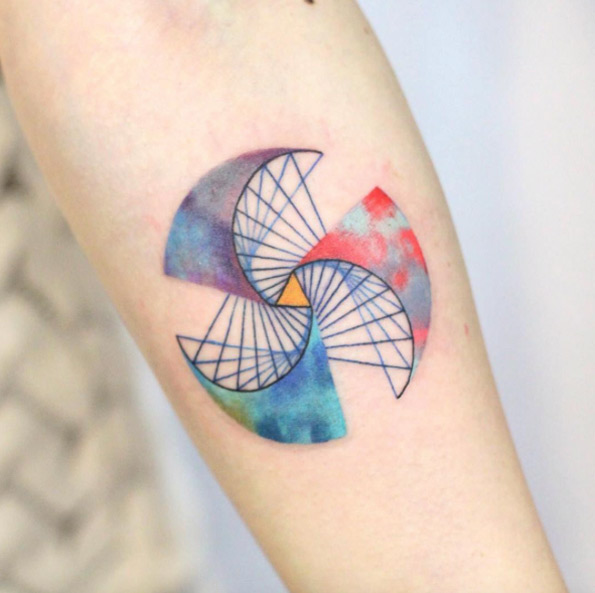 Geometric spiral tattoo by Justice Ink