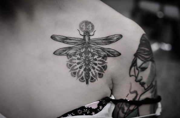 Dotwork dragonfly tattoo on shoulder by Chris Jones