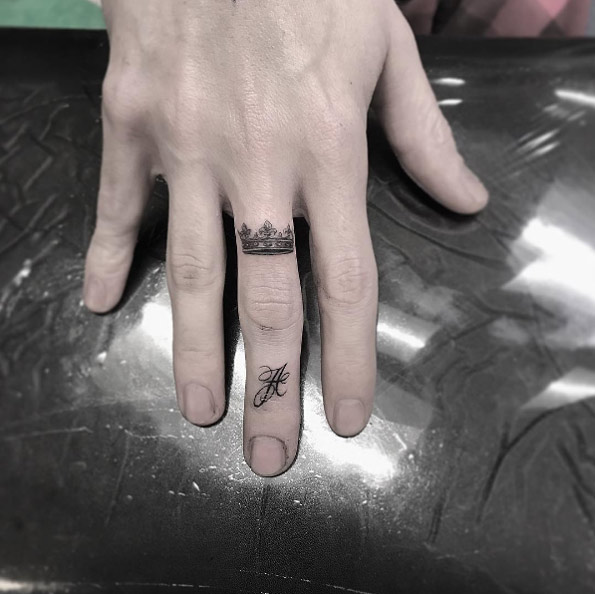 Small crown tattoo on knuckle by Isaiah Negrete