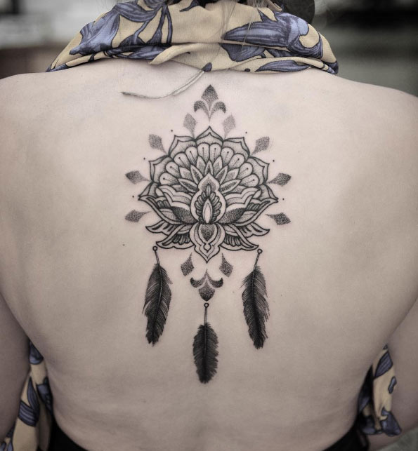 Creative mandala tattoo on back by Chris Jones